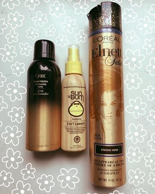 Oribe Anti-Humidity Spray, Sun Bum 3 in 1 Leave in Conditioner, and Elnett Hairspray- summer favorites for hair.